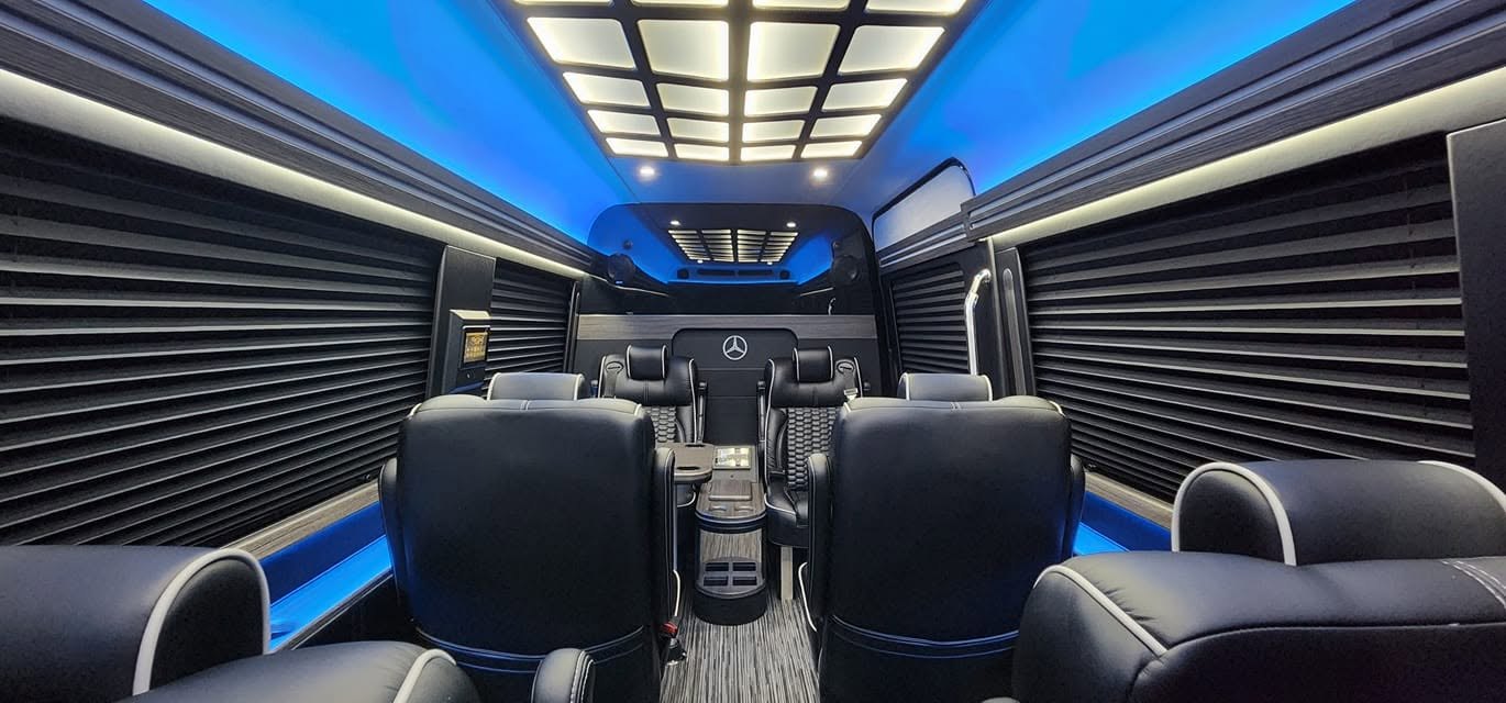 Executive Sprinter interior with leather captain's chairs and ambient lighting
